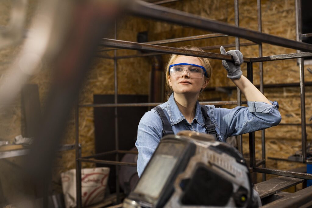image of a woman actively engaged on a construction site, demonstrating the significance of women's involvement in the construction industry